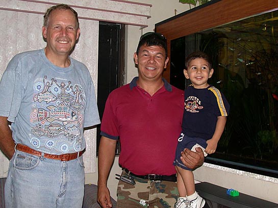 Left to Right: Ad Konings, Melo and Melito Salazar beside Melo super-community aquarium at Monterrey, México; April, 2004